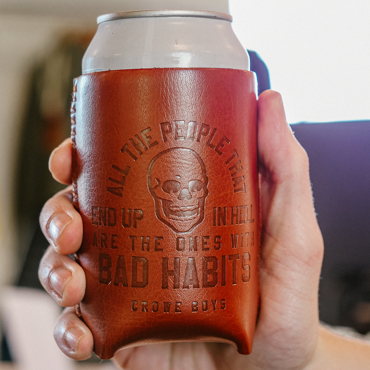 crowe boys brown leather koozie in hand