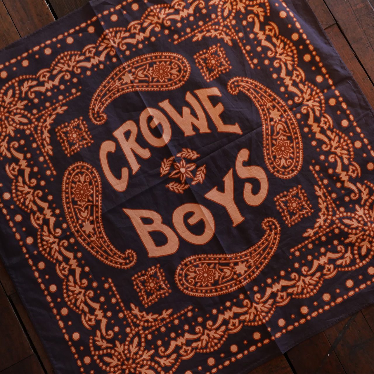 Crowe Boys bandana on wooden floor