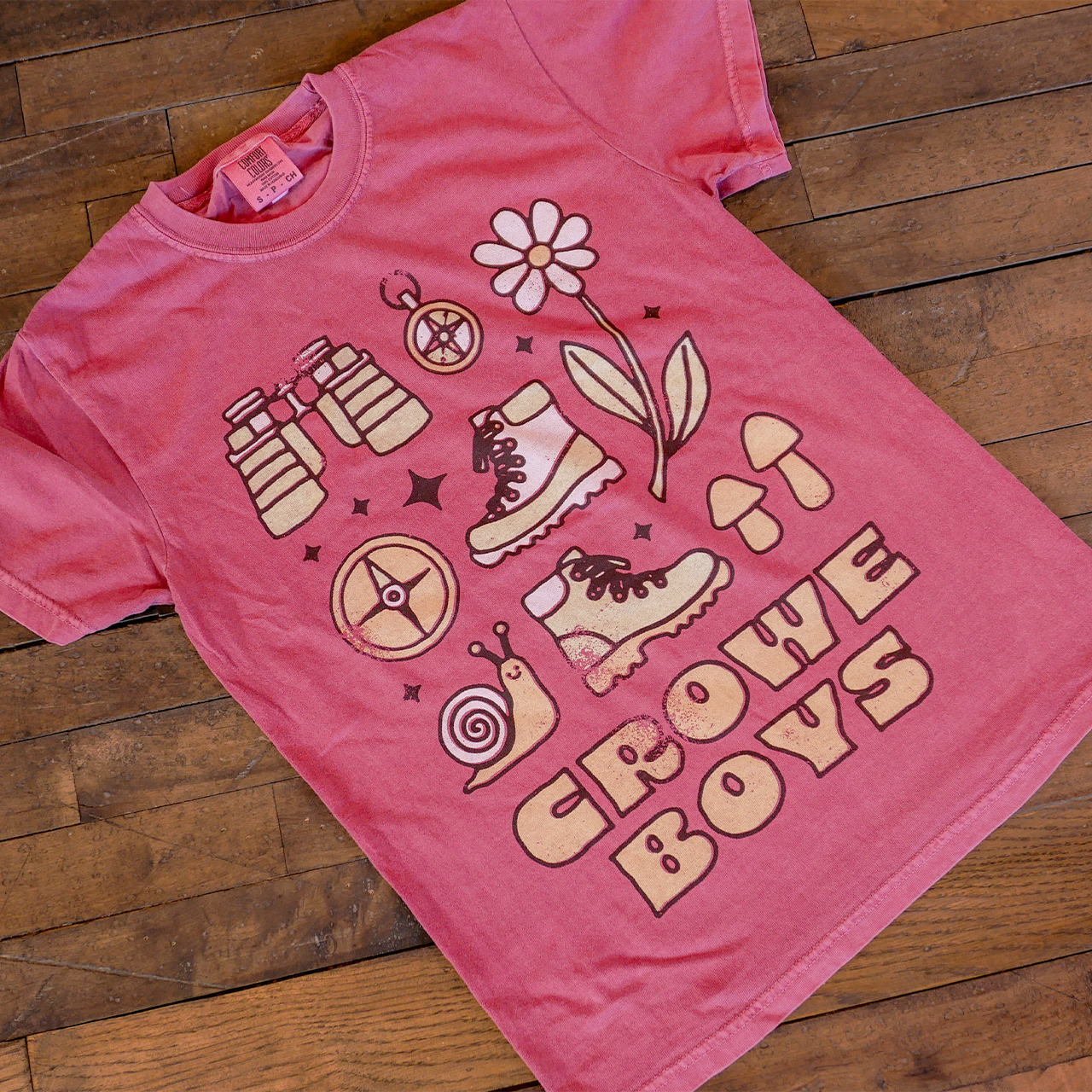 crowe boys nature tee featuring illustrative graphics on wooden floor